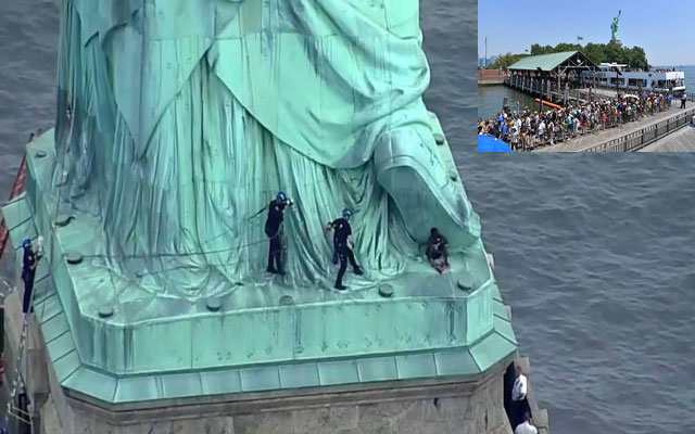 ثلاث ساعات من مطاردة امرأة اعتلت تمثال الحرية بنيويورك.. (مع فيديو)